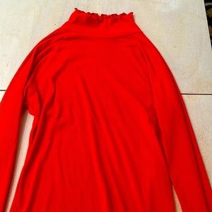 Orange turtleneck